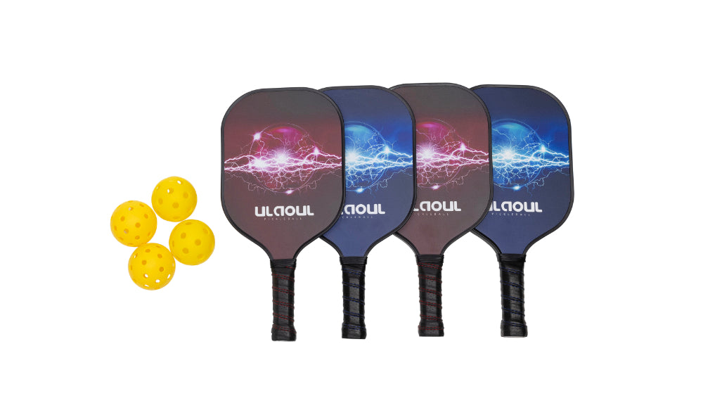 four graphite pickleball paddles and wiffle balls